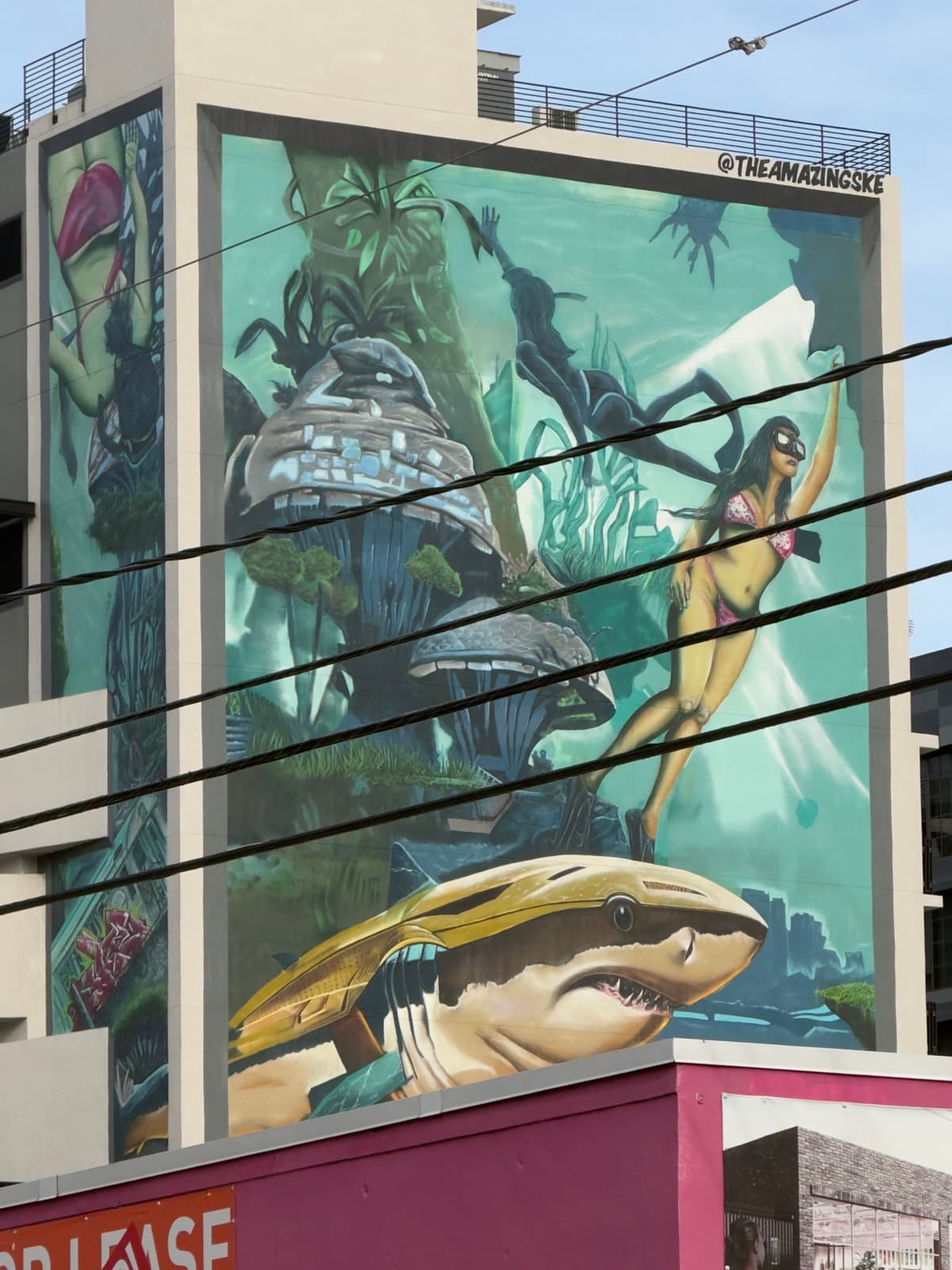 A large spray-painted mural covering a Miami warehouse wall.